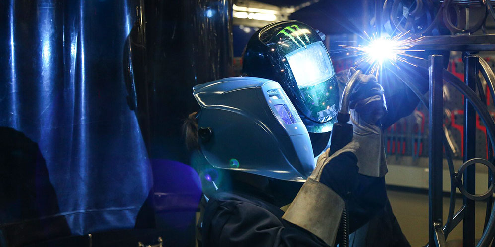 two students welding