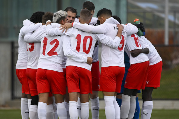 Soccer players in a huddle