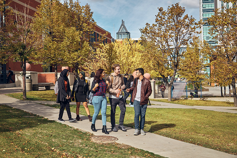 Students chatting and walking in the SAIT campus