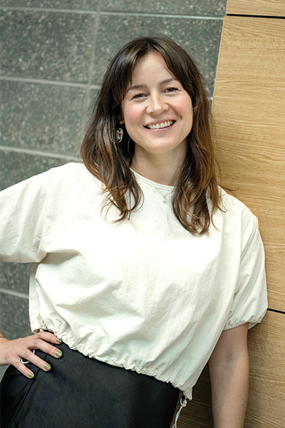 Young white woman in white shirt smiling